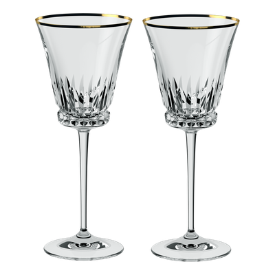 A pair of gold-rimmed crystal wine glasses