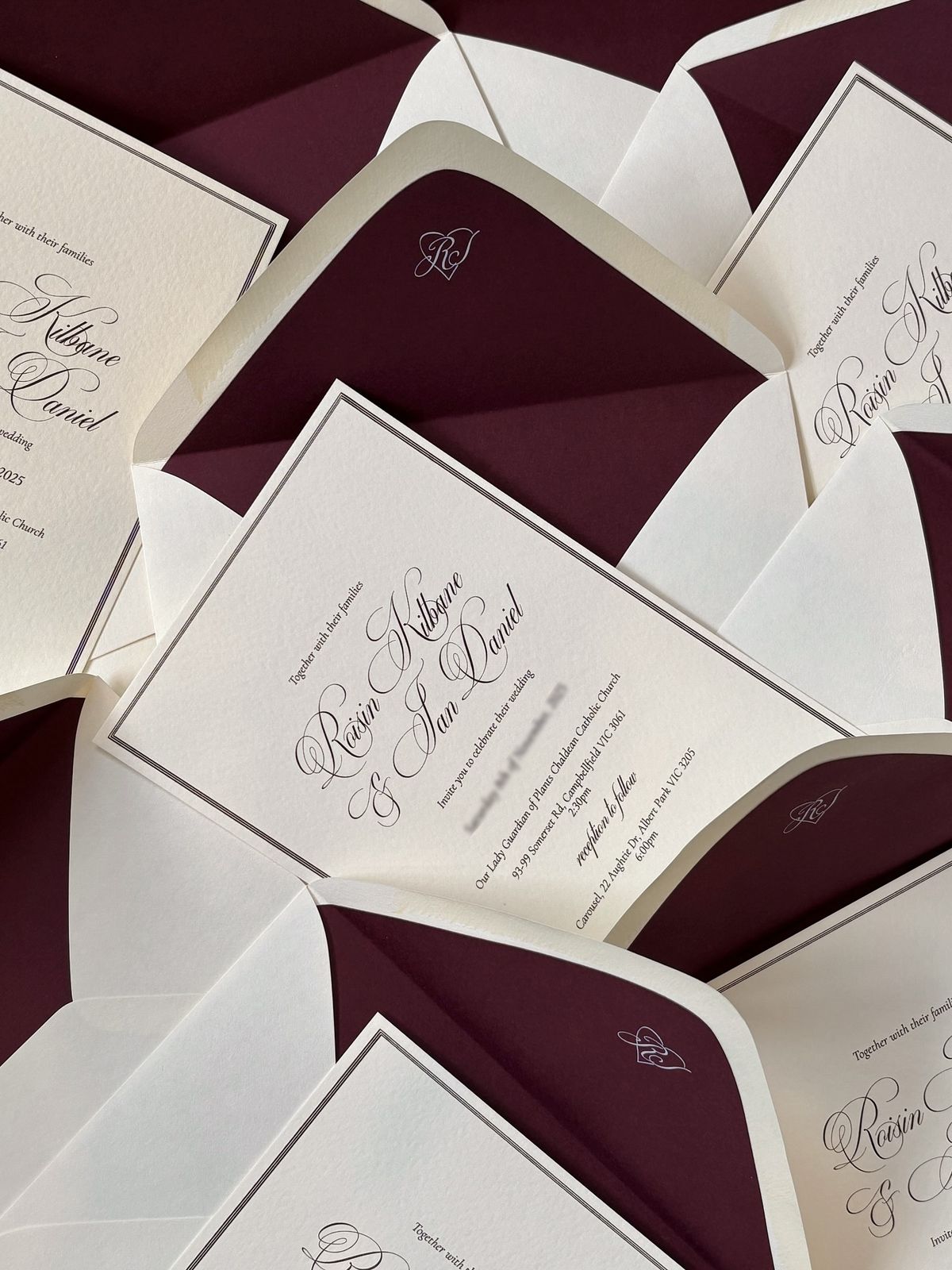 Letterpress wedding invitations with burgundy envelope liners